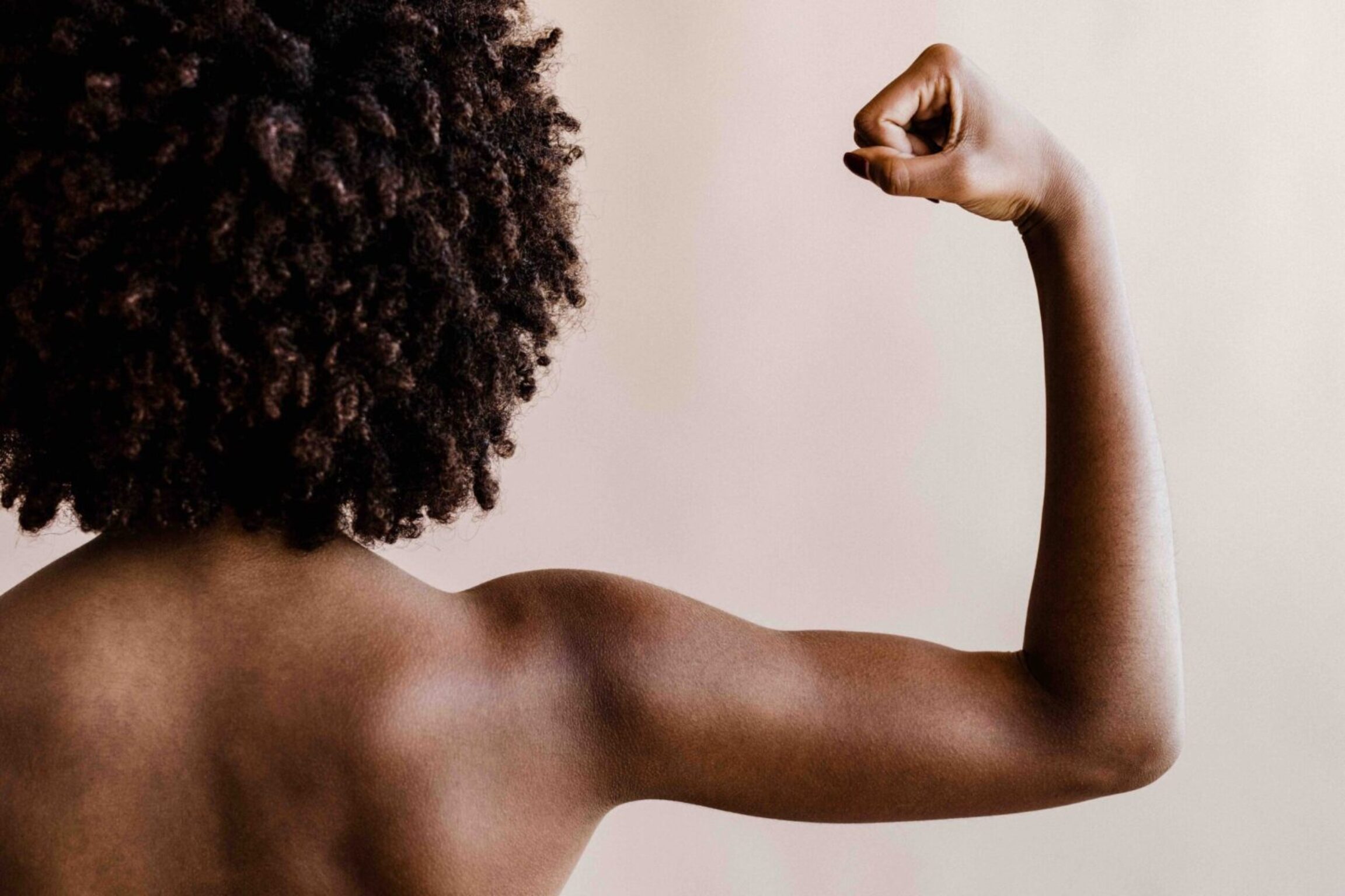 Photo of a strong woman flexing