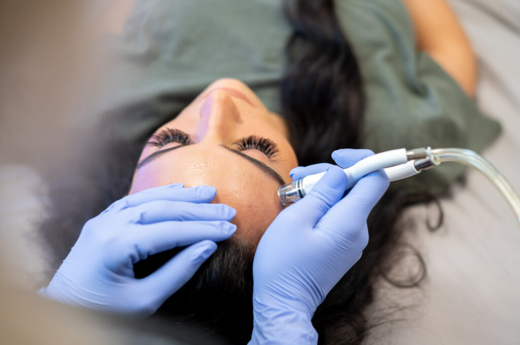 A close look at a patient receiving a deep cleaning facial 