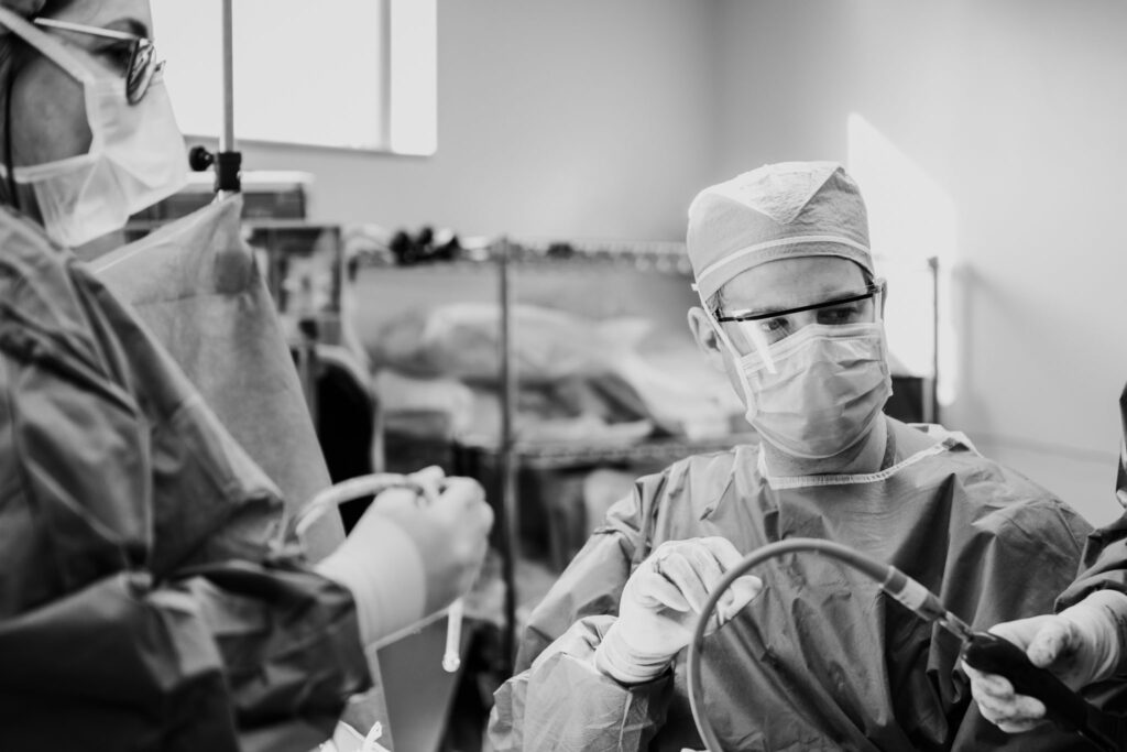 Liposuction surgeons using a cannula
