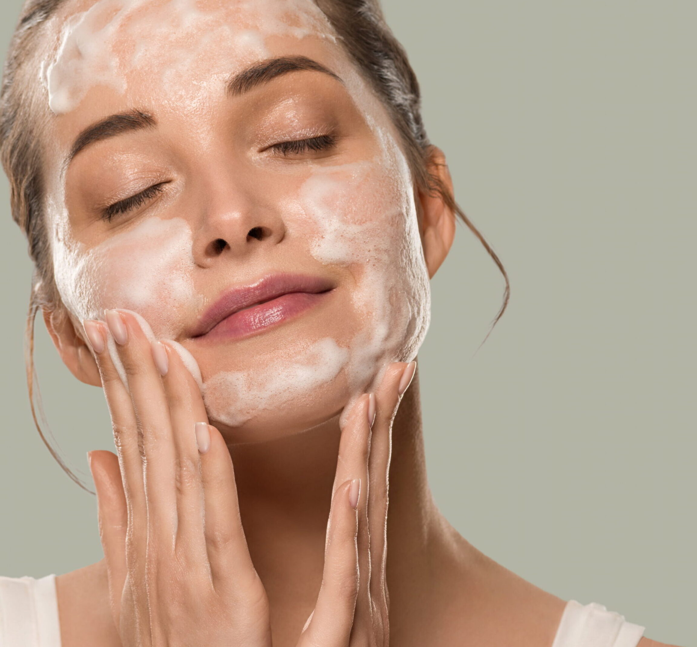 Patient scrubbing face with medical grade products