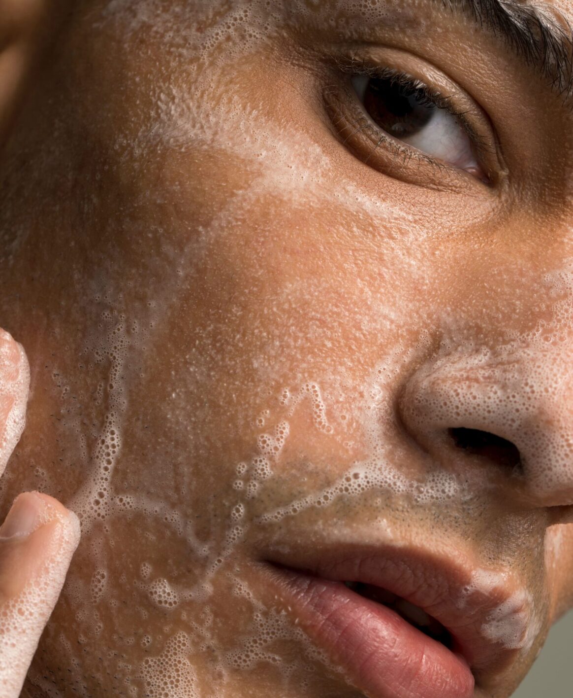 Close up of male washing face