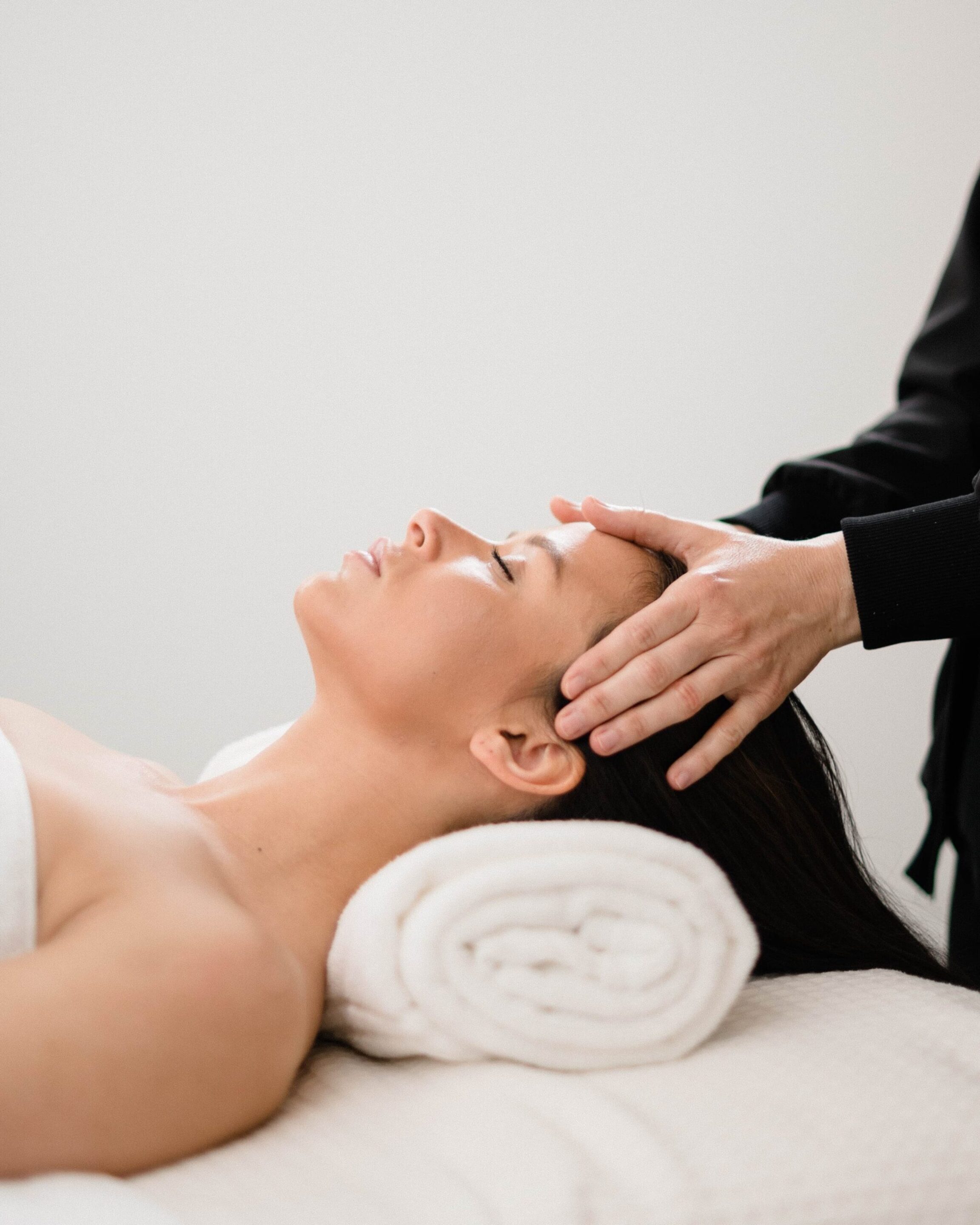 Nikki performing an acne treatment