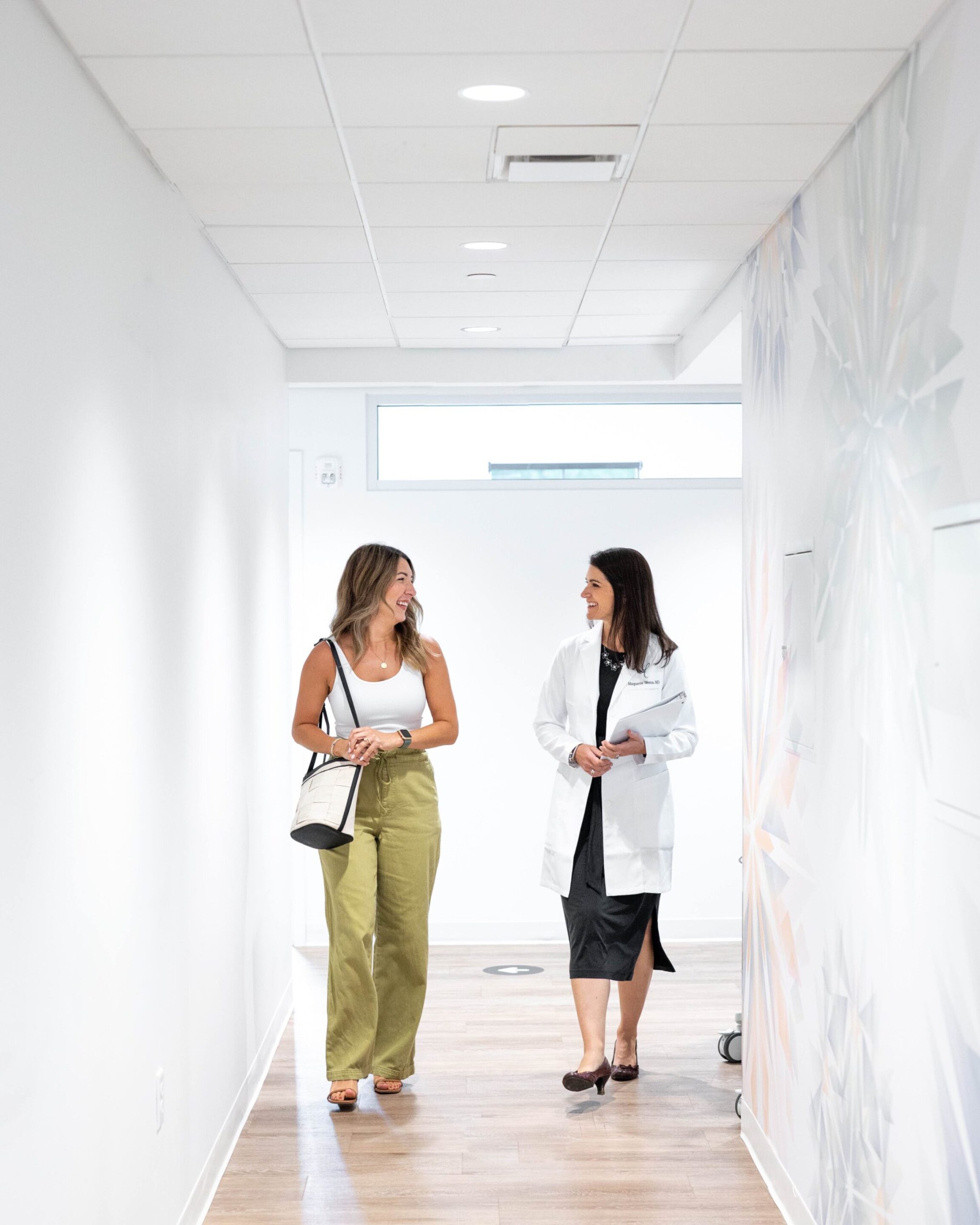 Dr. Weston walking down the hall with a patient