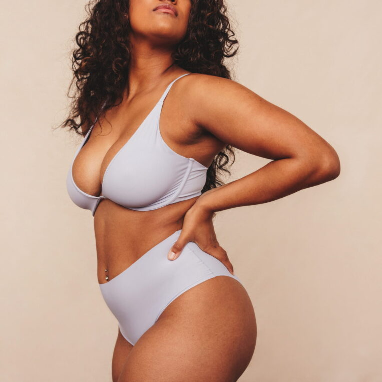 Patient showing body contours after liposuction surgery