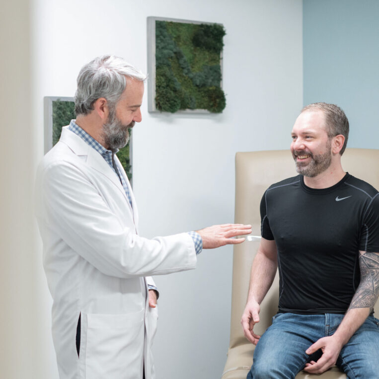 Dr. Donaldson discussing Columbus, Ohio skin tightening surgery with a patient in the office