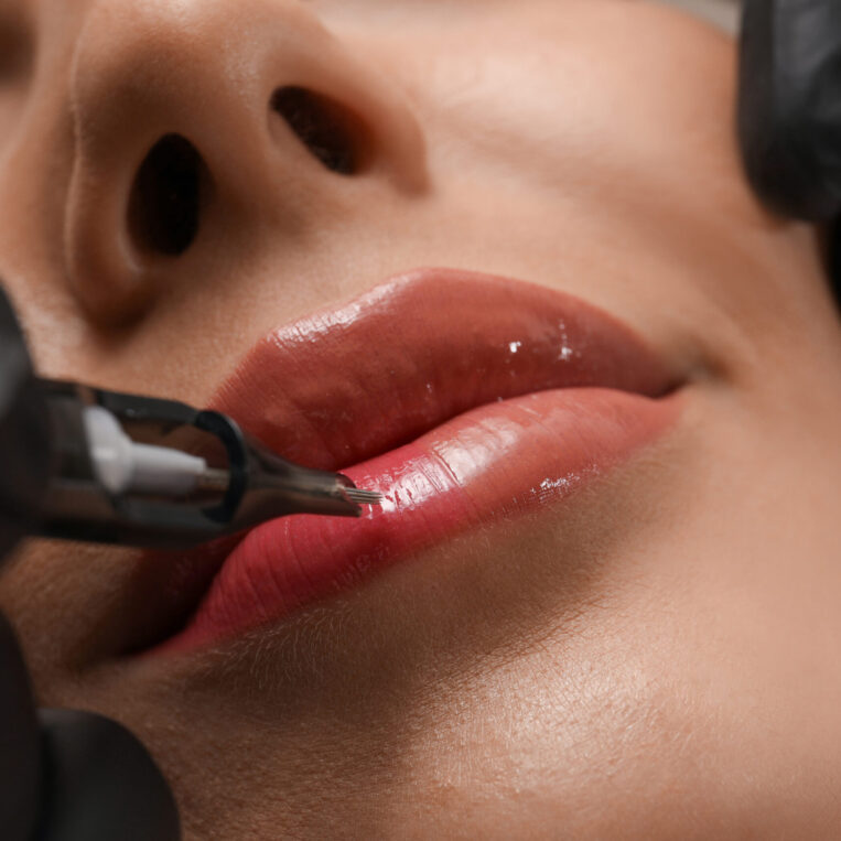 Andie performing Lip Blushing tattoos