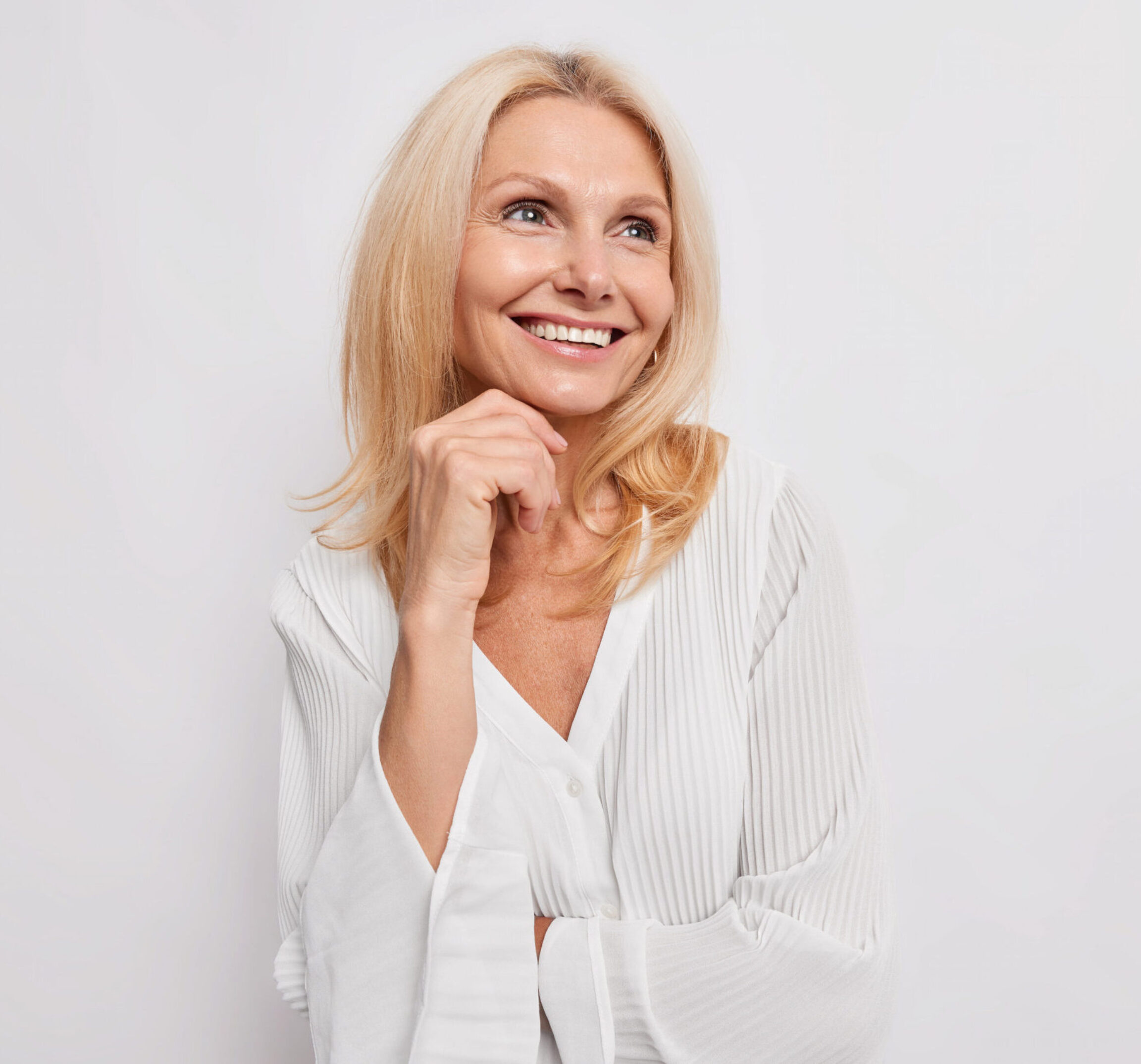 Functional medicine patient smiling in white clothes