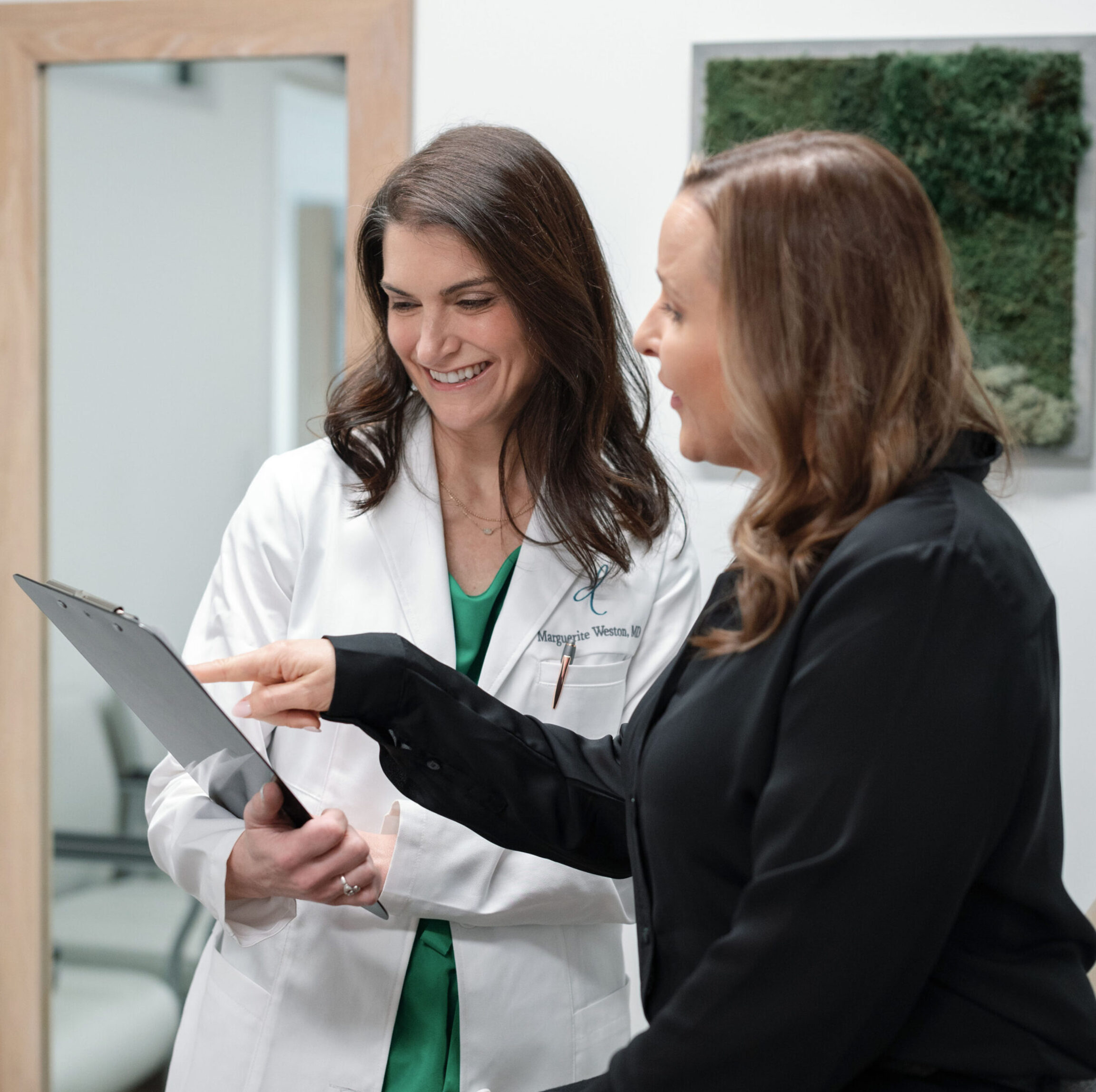 Dr. Weston discussing hormone therapy with a functional medicine patient in Columbus, Ohio office