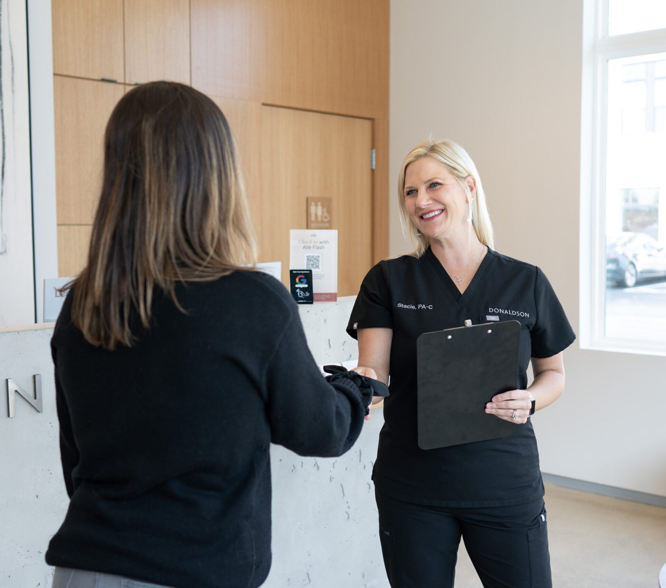 Stacie Isler, PA-C, meeting with a liquid rhinoplasty patient in Lewis Center Ohio