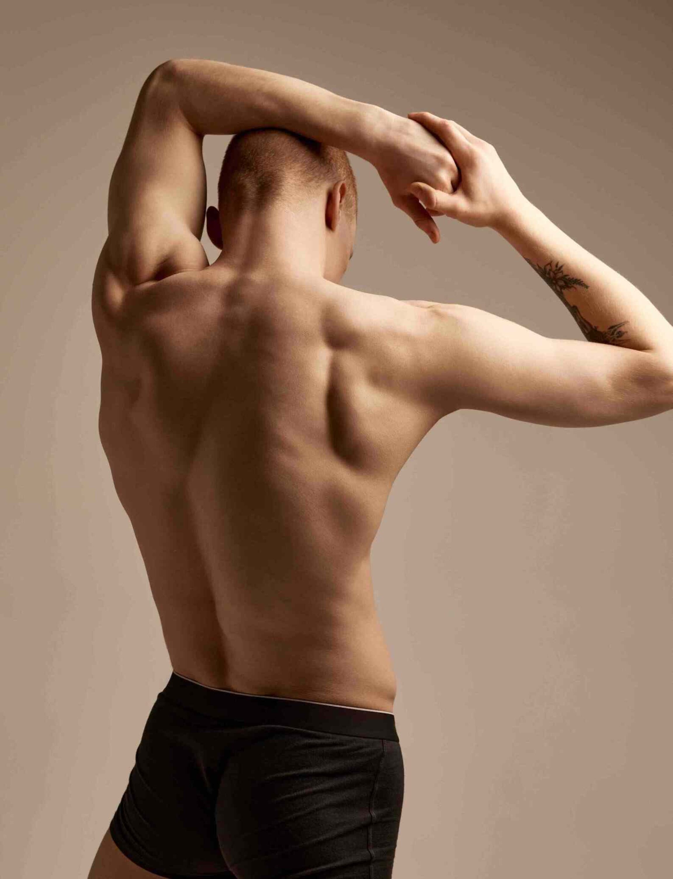 Photo from behind of a male patient posing