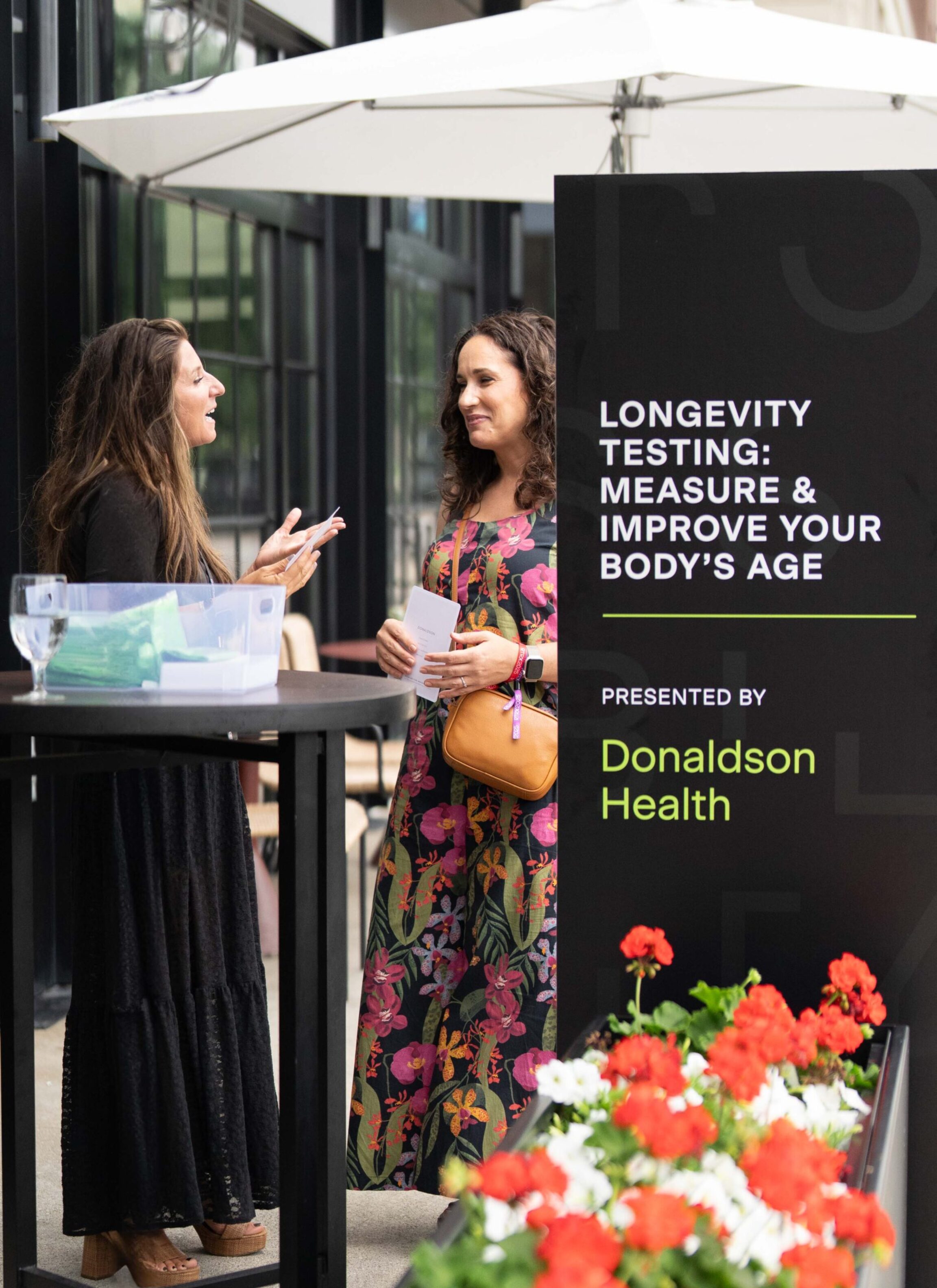 Laura discussing the longevity circuit with an RTRX attendee