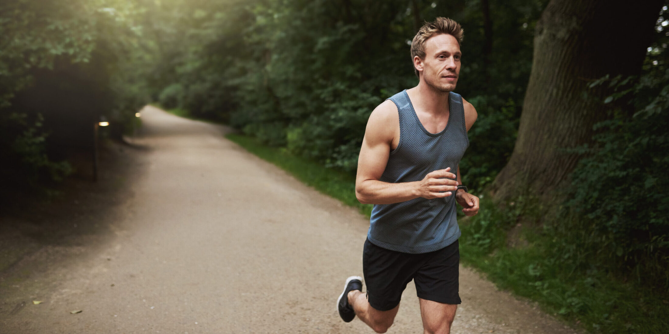 Man running on a metro park trail near Columbus ohio