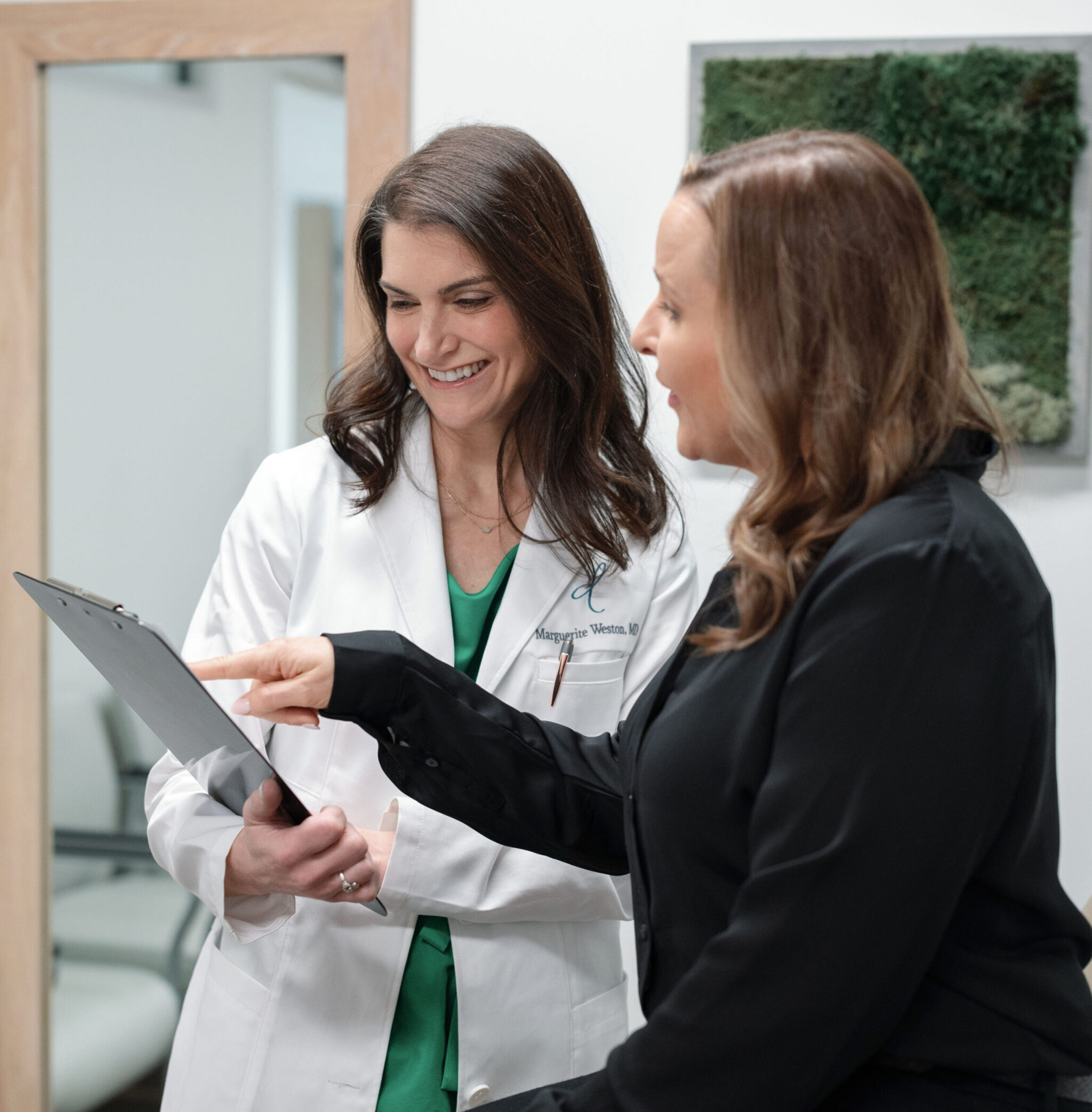Dr. Marguerite Weston discussing treatment plan options with a patient in Dublin, Ohio