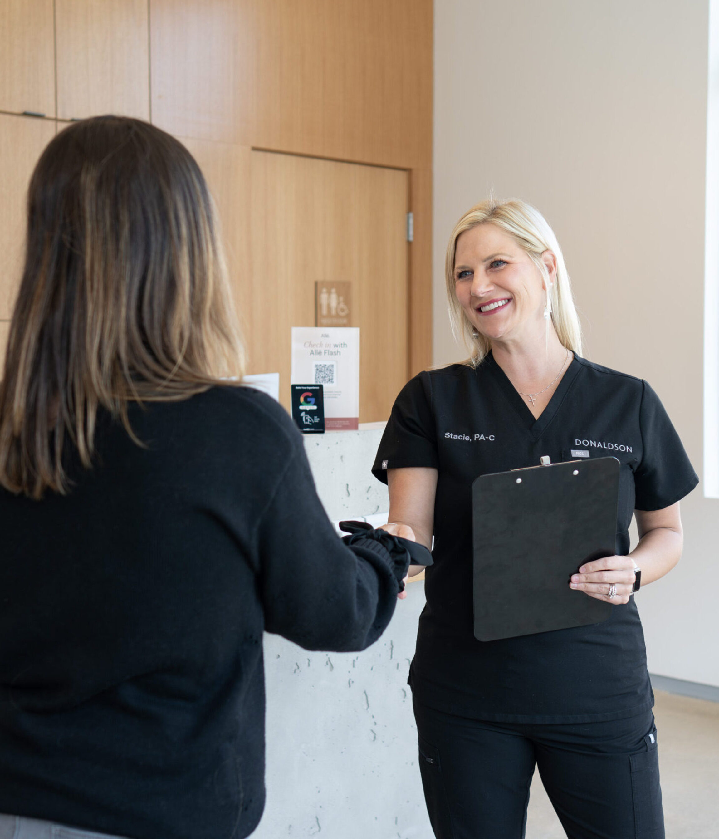 Stacie Isler, PA-C, meeting with a surgical patient in Lewis Center, Ohio