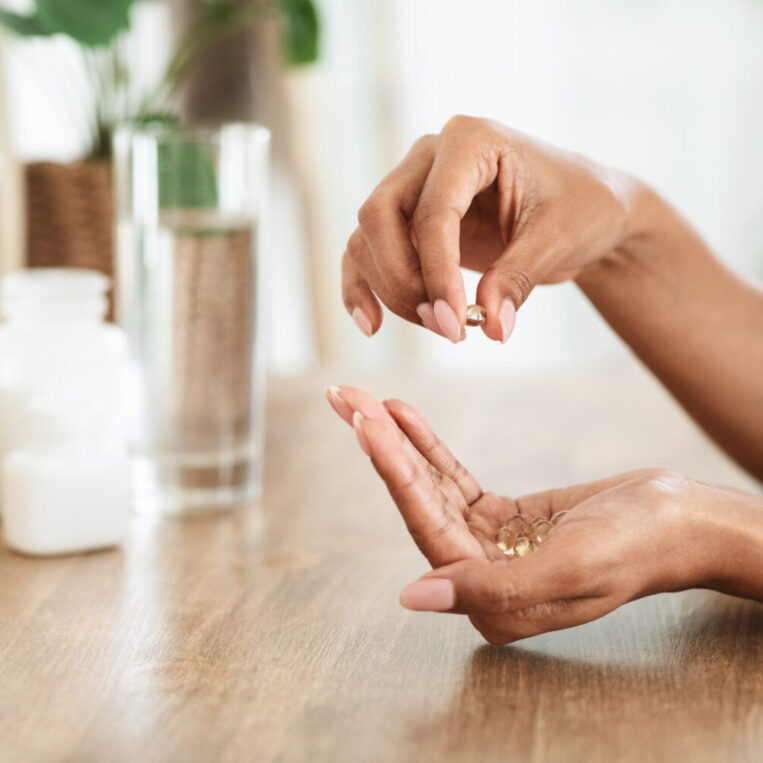 A patient preparing to take their morning supplements