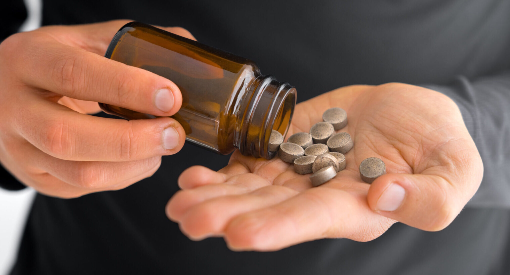 A patient looking at their gut health supplements to see how many are left