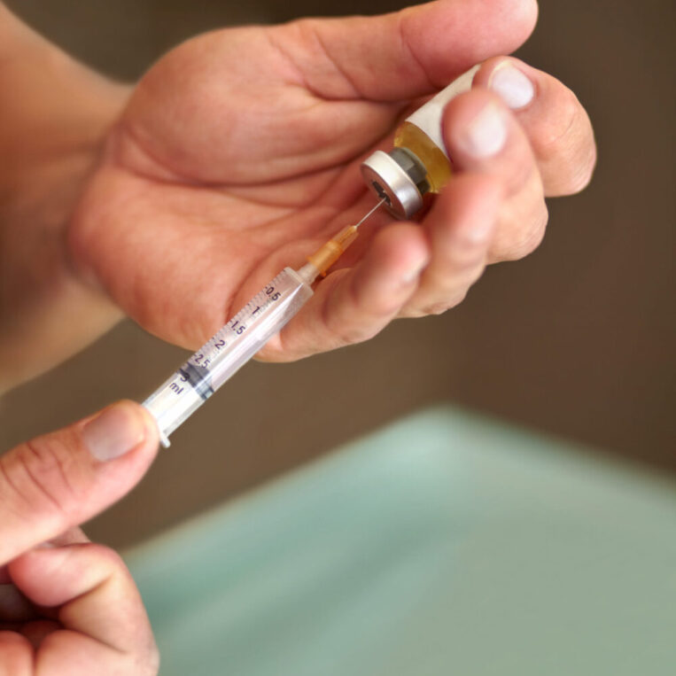 A patient preparing their compounded GLP-1 injection