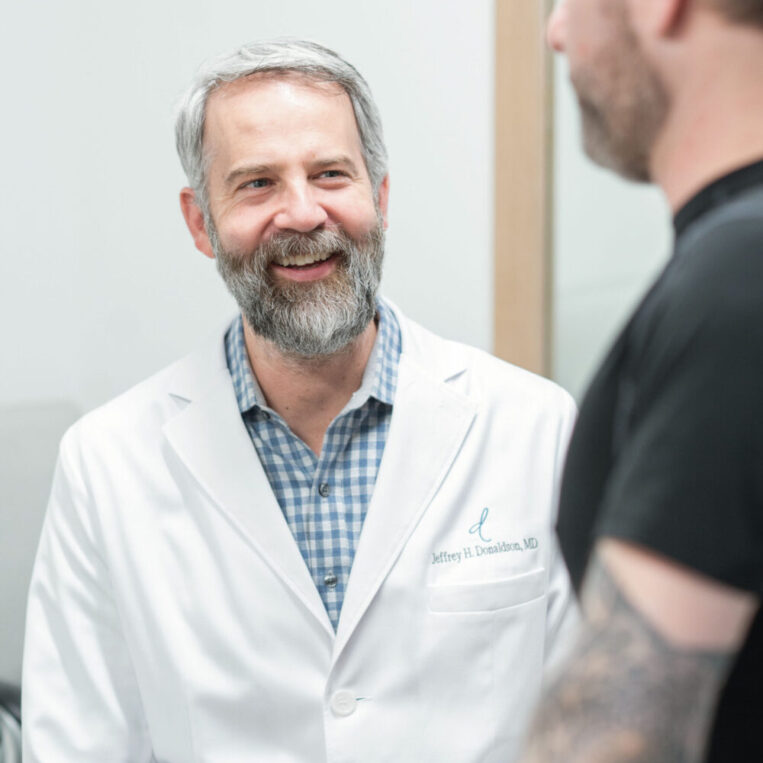 Dr. Donaldson discussing in-office gynecomastia removal with a male patient