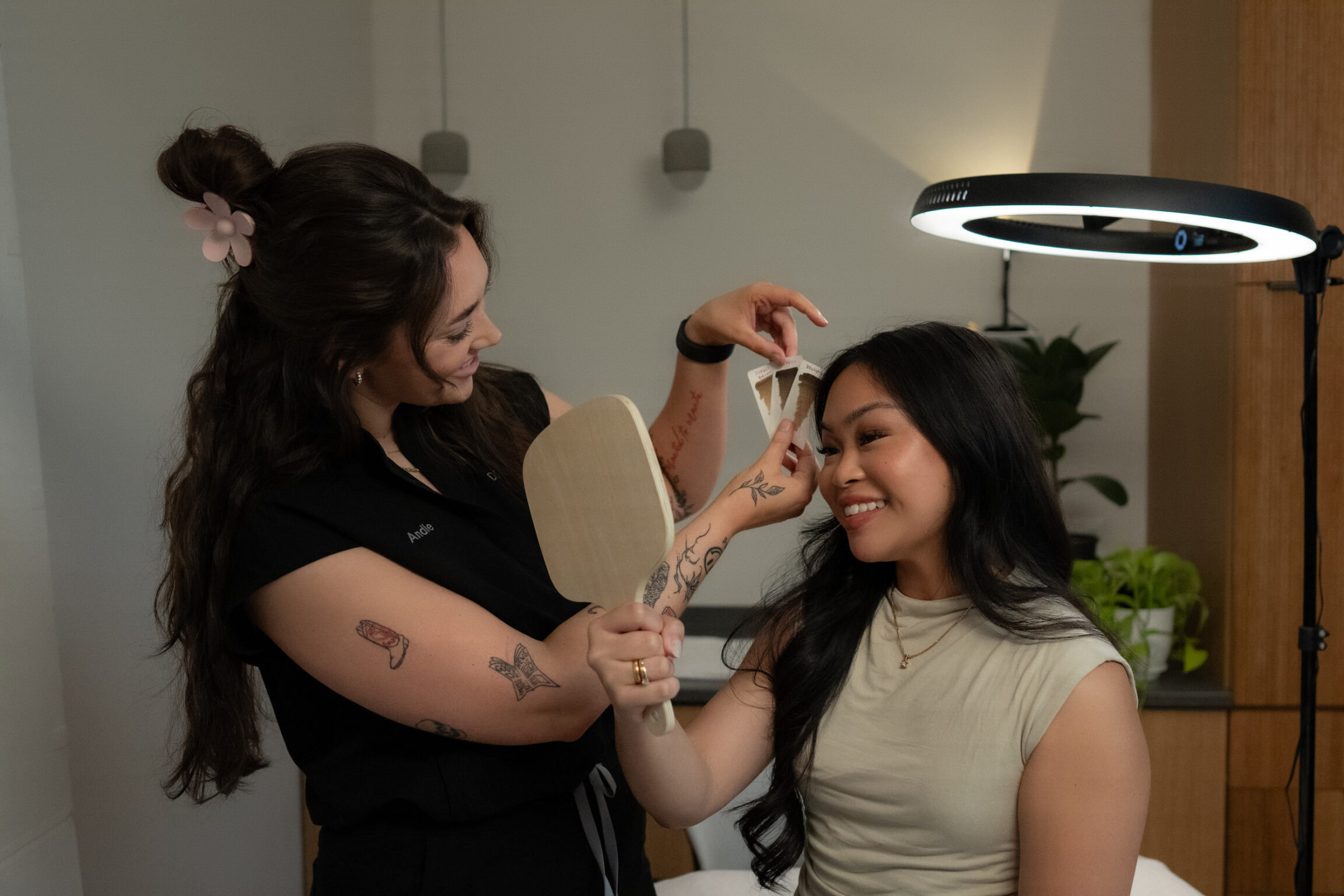 Andie performing permanent eyeliner treatment on patient