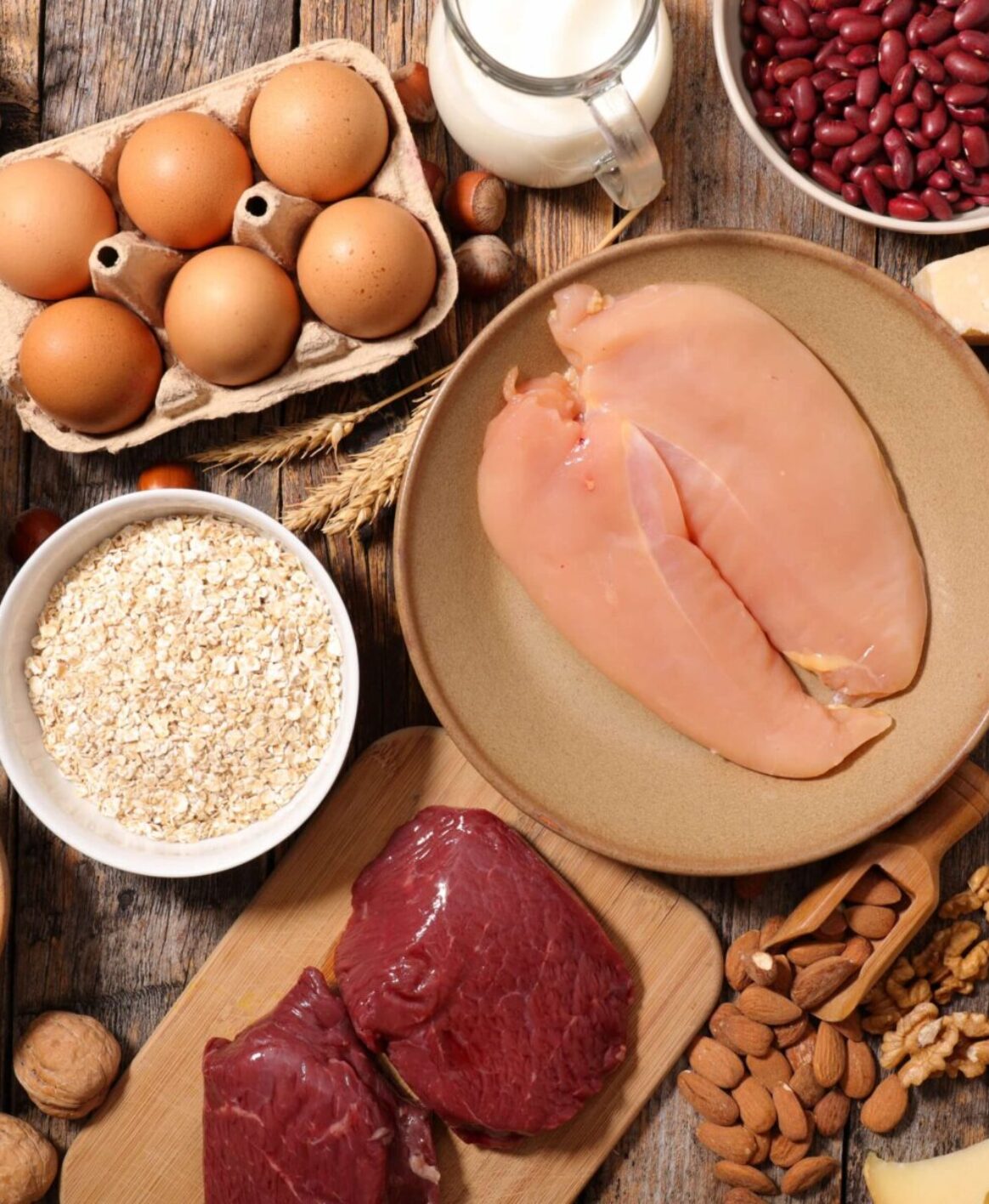 A table spread of high-protein foods containing meats and legumes