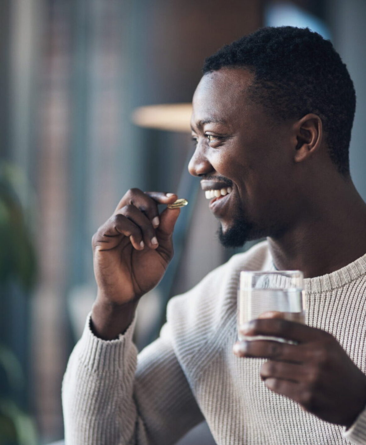 A male patient taking his morning supplements