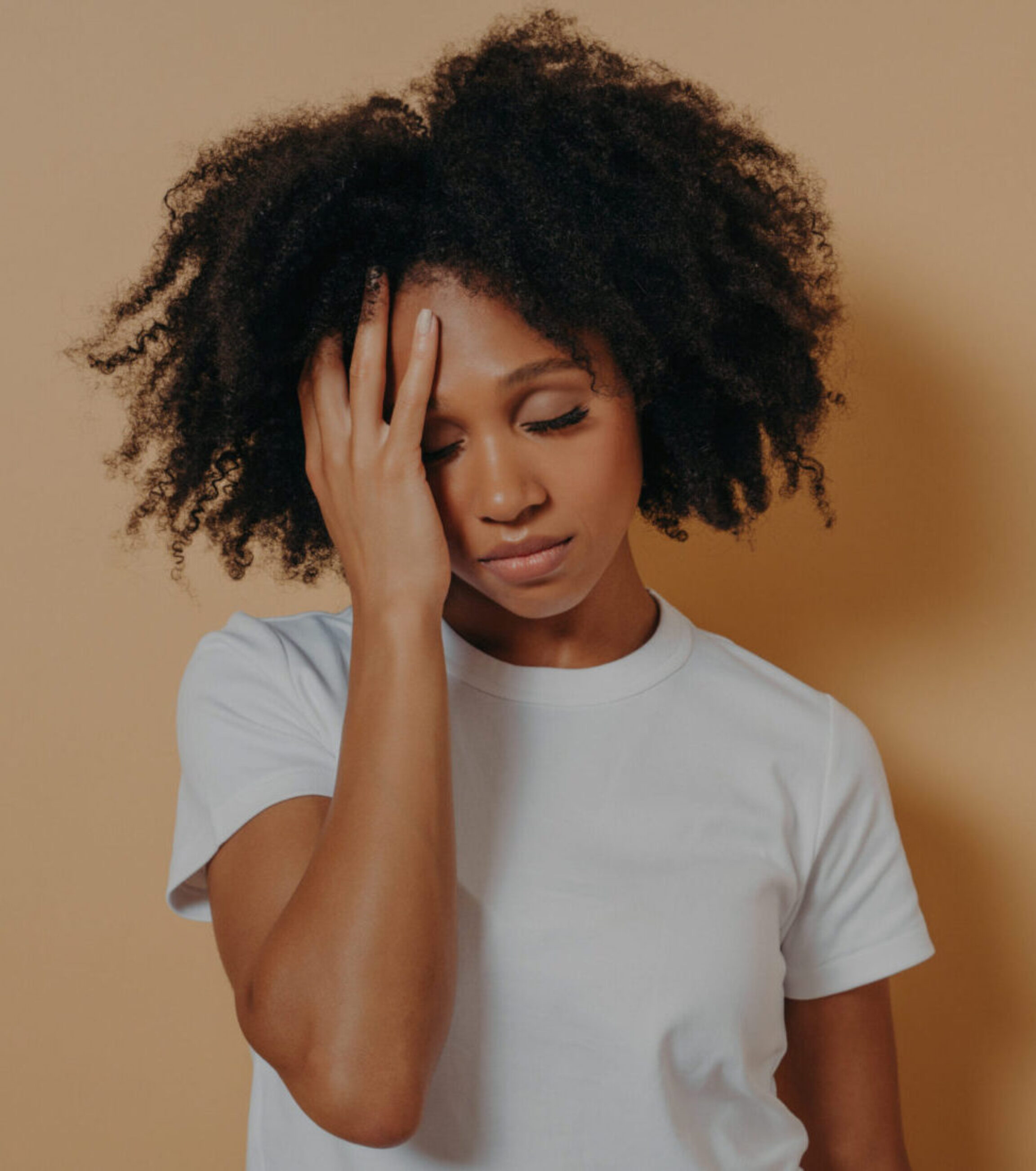 A woman struggling to remember what she was supposed to do