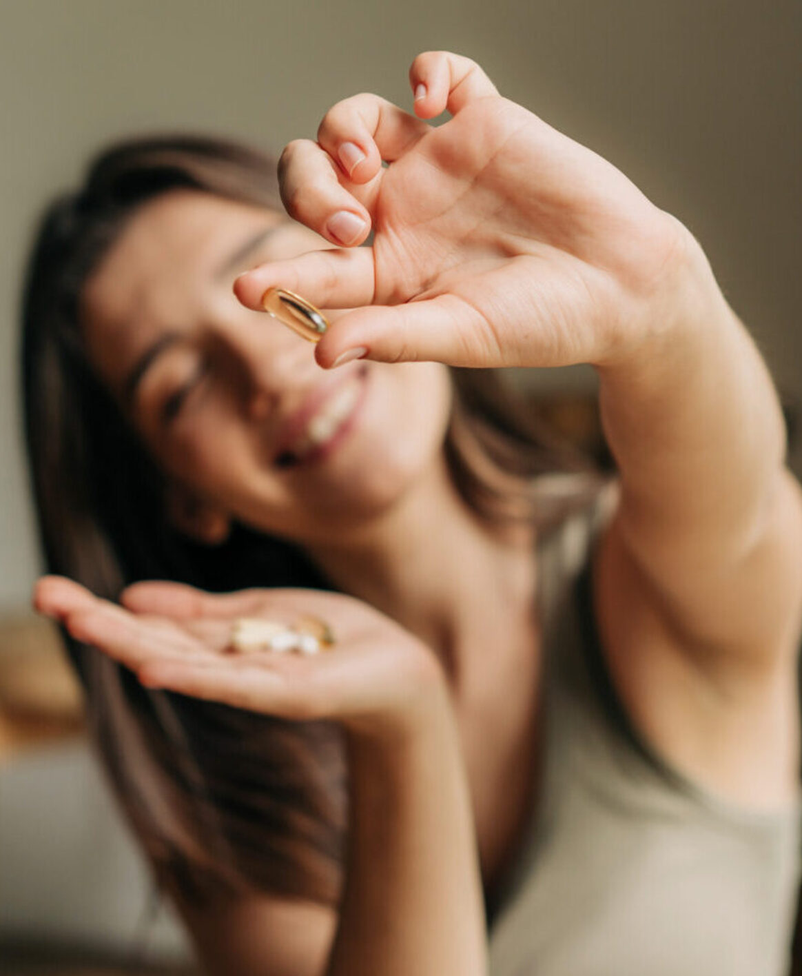 Functional medicine patient holding her ADHD medication