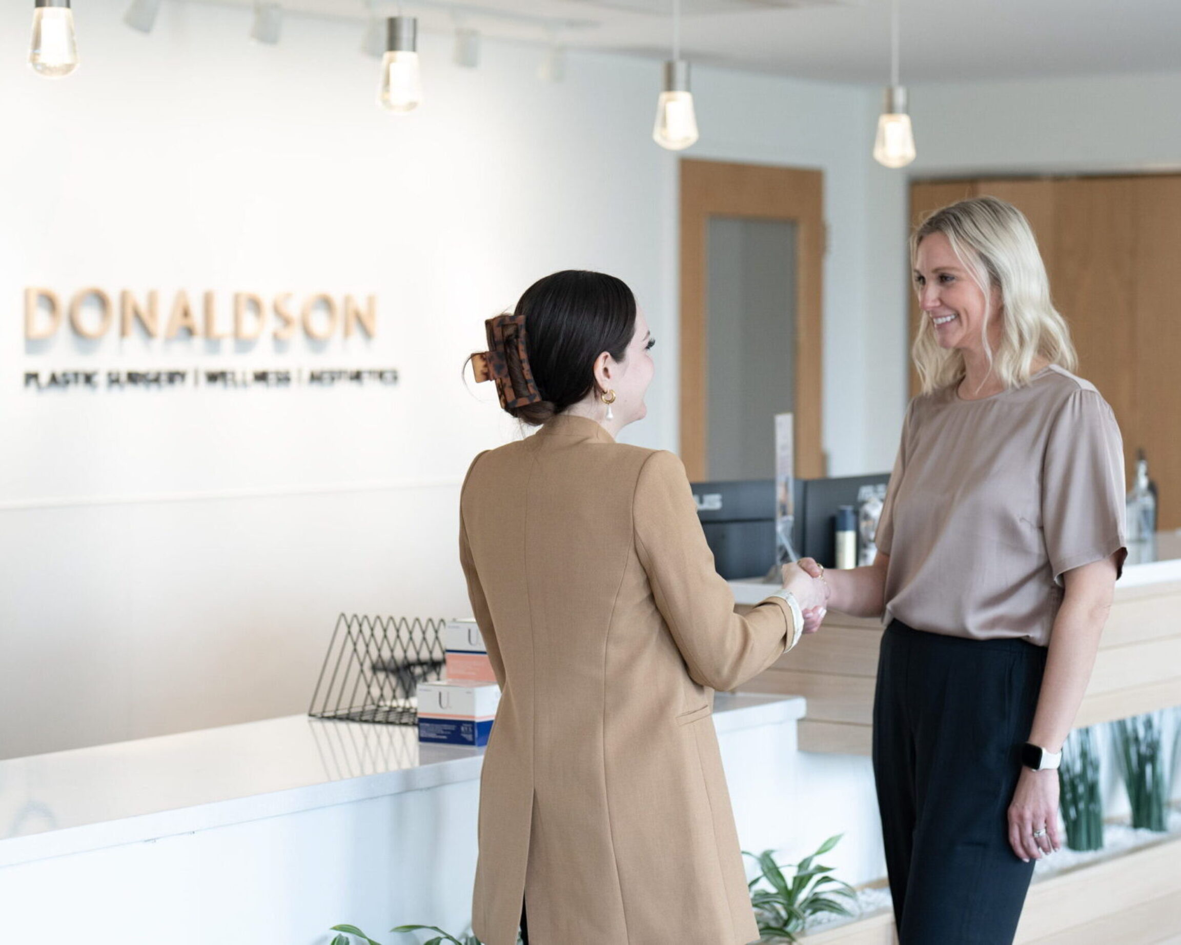 Colleen meeting with a patient for their first consultation