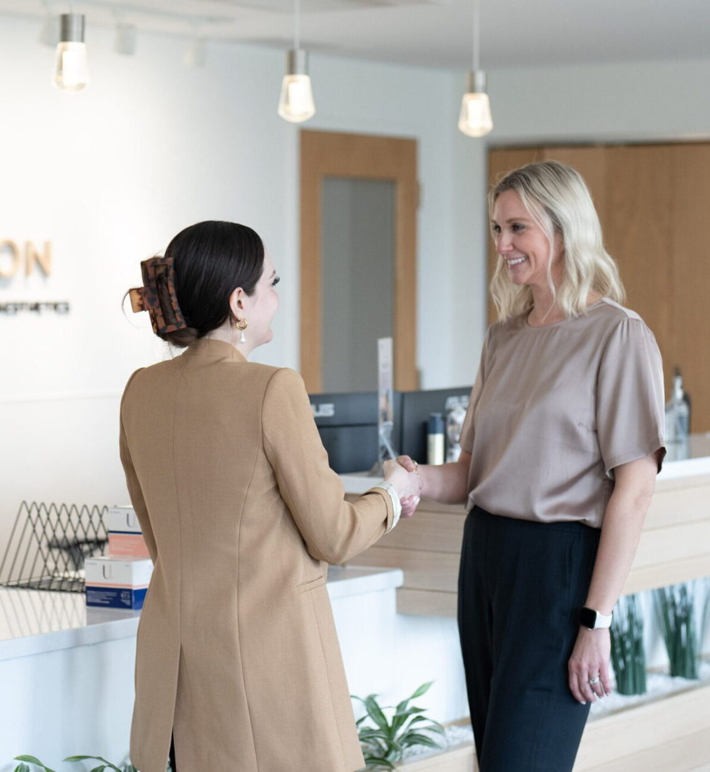 Colleen meeting with a patient for their first consultation