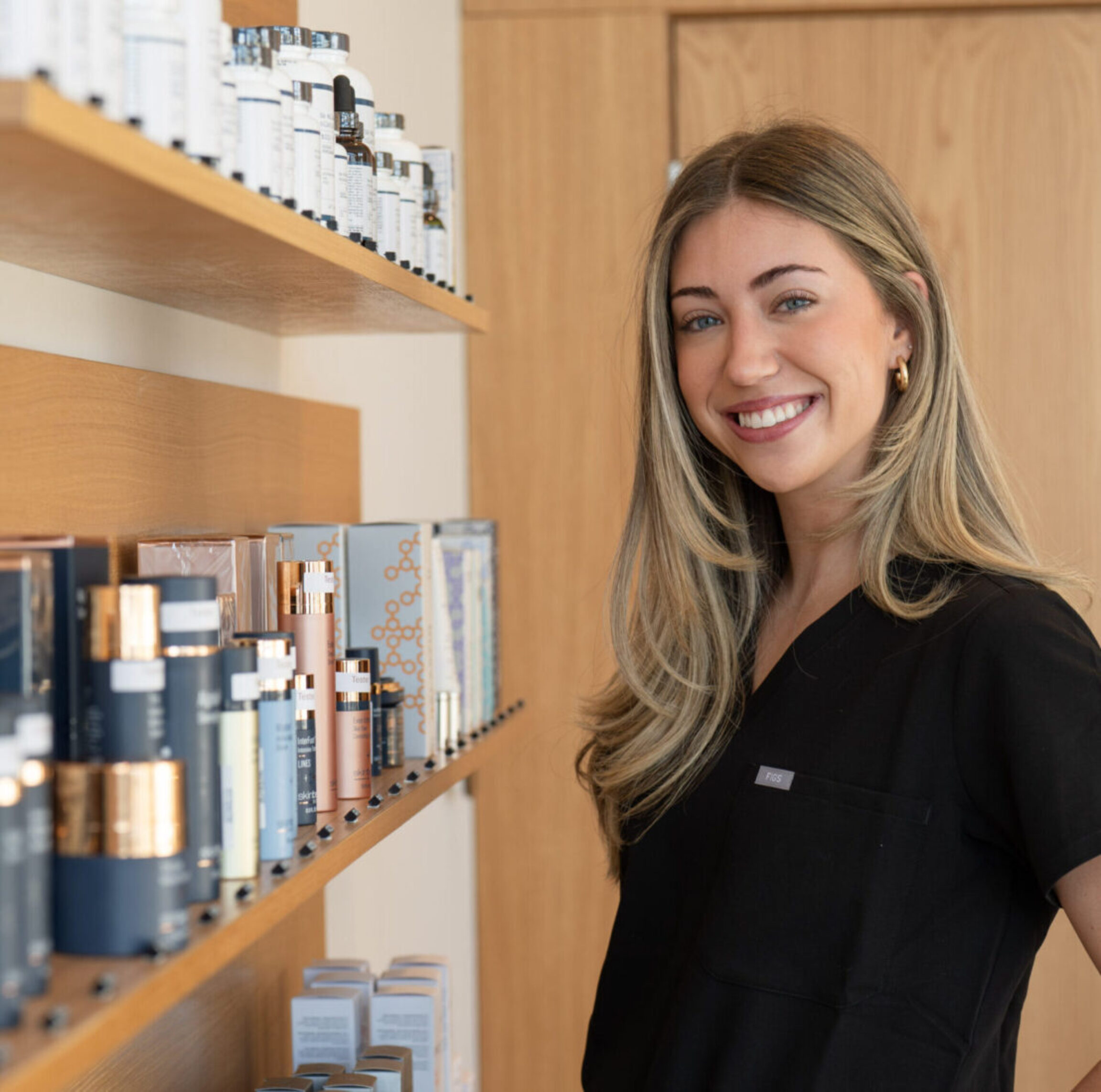 Aubrey Wilcox walking through the skincare section of the Donaldson Plastic Surgery office