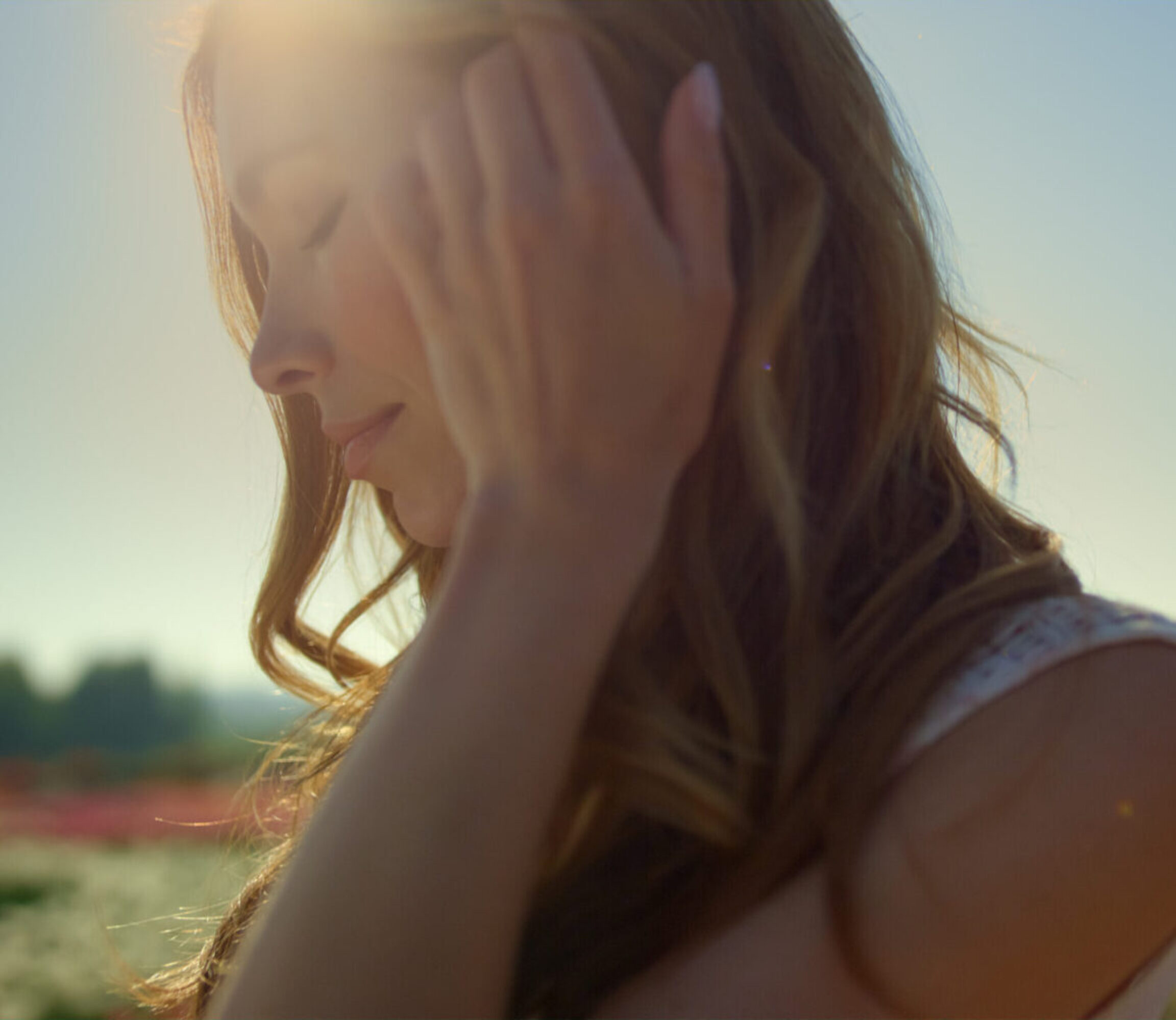 A functional medicine patient outside during a sunny day