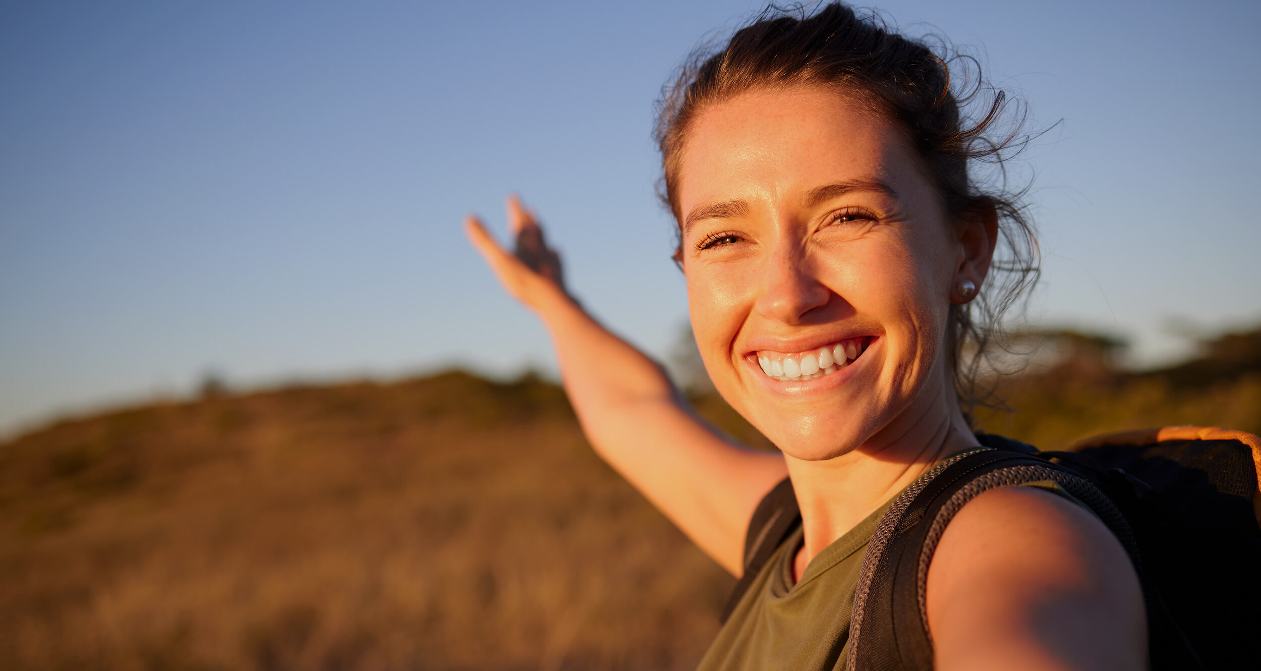 A functional medicine patient exploring an open field in the Midwest