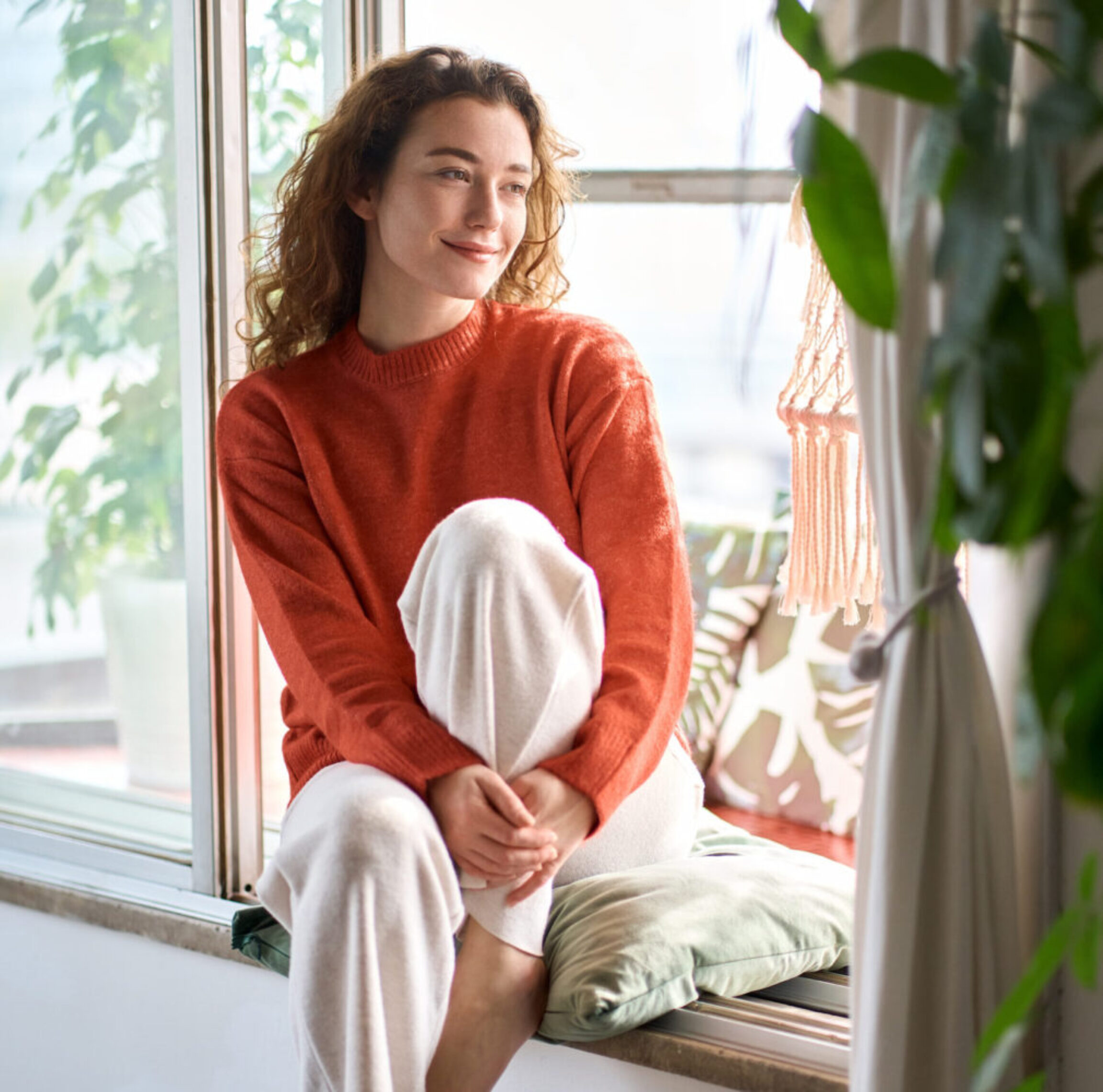 A Columbus Ohio Chronic Fatigue patient waiting for her diagnostic lab results while sitting hopefully in the bay window of her suburban home