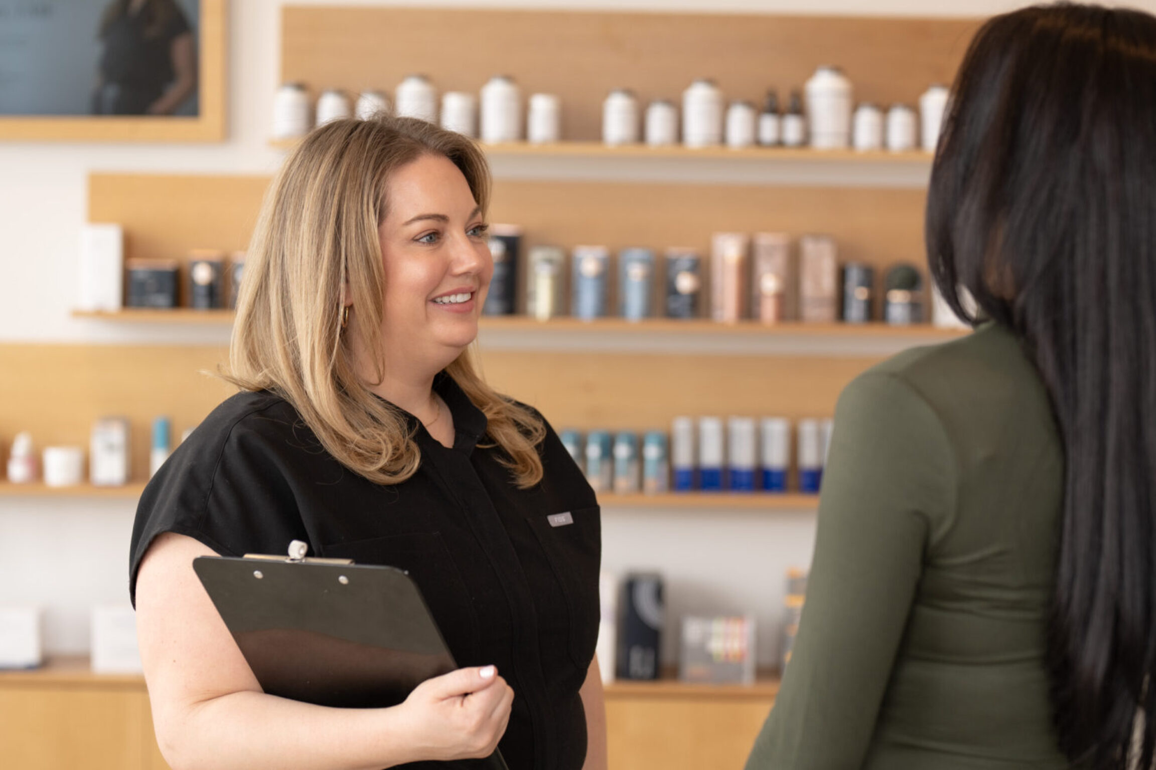 Paige discussing supplements with a functional medicine patient in Lewis Center