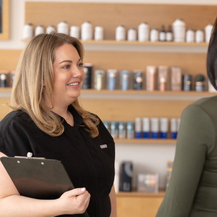 Paige meeting with a patient to discuss preparing the skin for face surgery