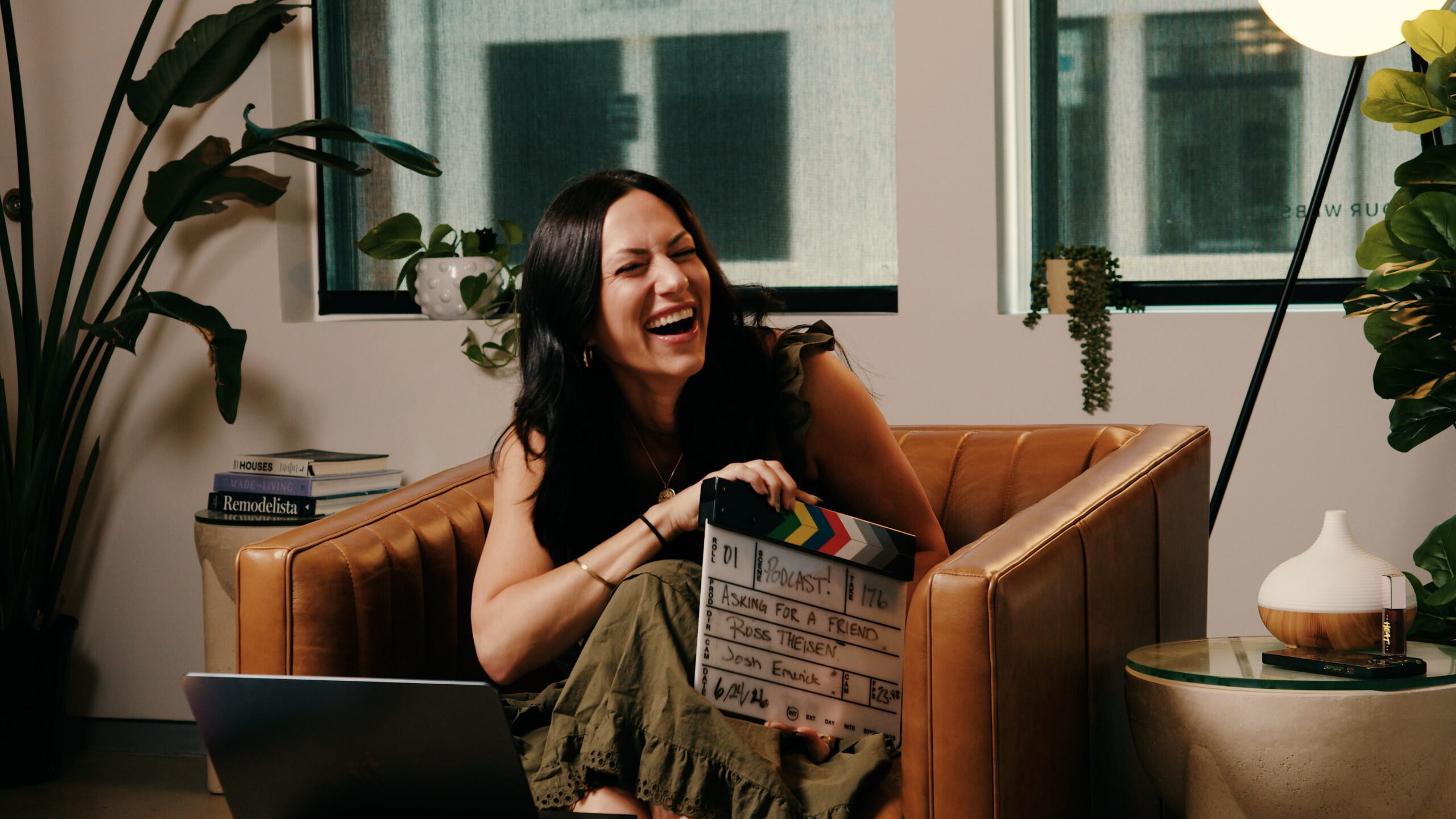 Host of the AFAF podcast Jillian holding the clapperboard