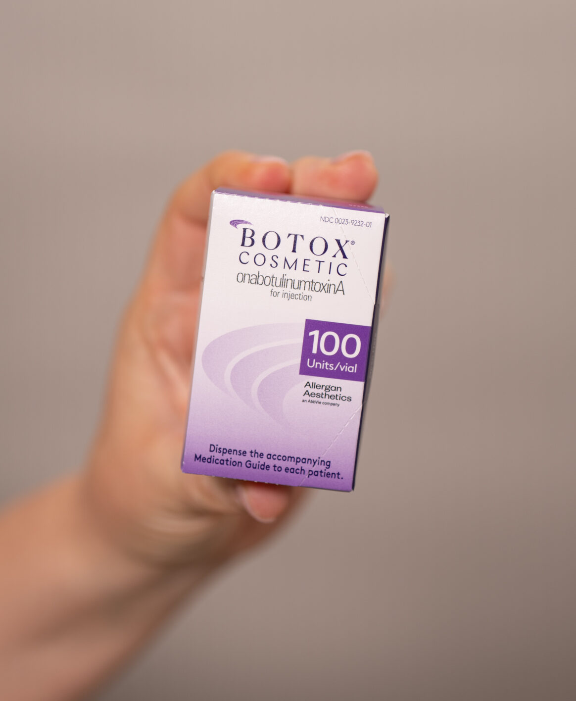 Paige showcasing an up-close photo of an unopened Botox package